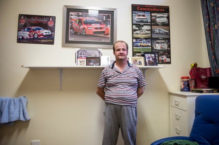 Kenny Taylor in his bedroom at Riverside with some of his favourite things, pictures of racing cars.