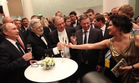 Vladimir Putin, left, and Anna Netrebko, right, and many other people