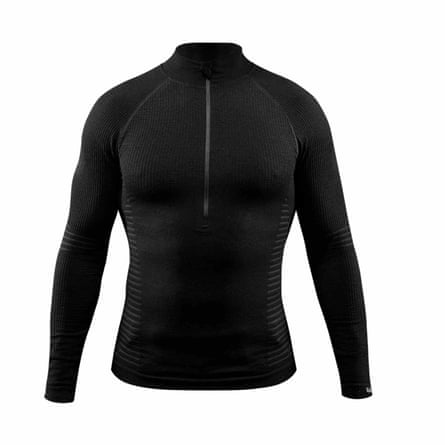 A Thrudark Stealth seamless base top. It is black with a short neck collar, a zip from the next to the middle of the top. The top is long sleeved.