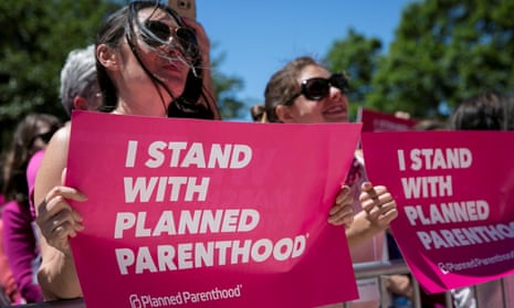 Demonstrators hold placards during a Planned Parenthood rally outside the state capitol in Austin, Texas, in 2017. But is this really the best slogan?