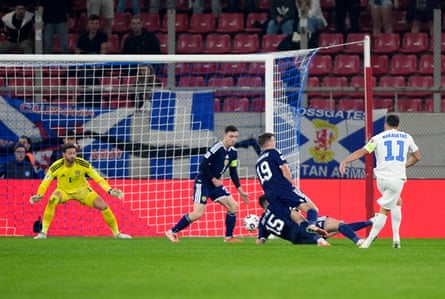 Greece's Anastasios Bakasetas scores his side's first goal.