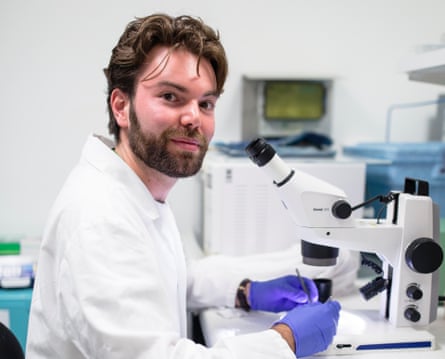 Jesse Gardner-Russell with a microscope