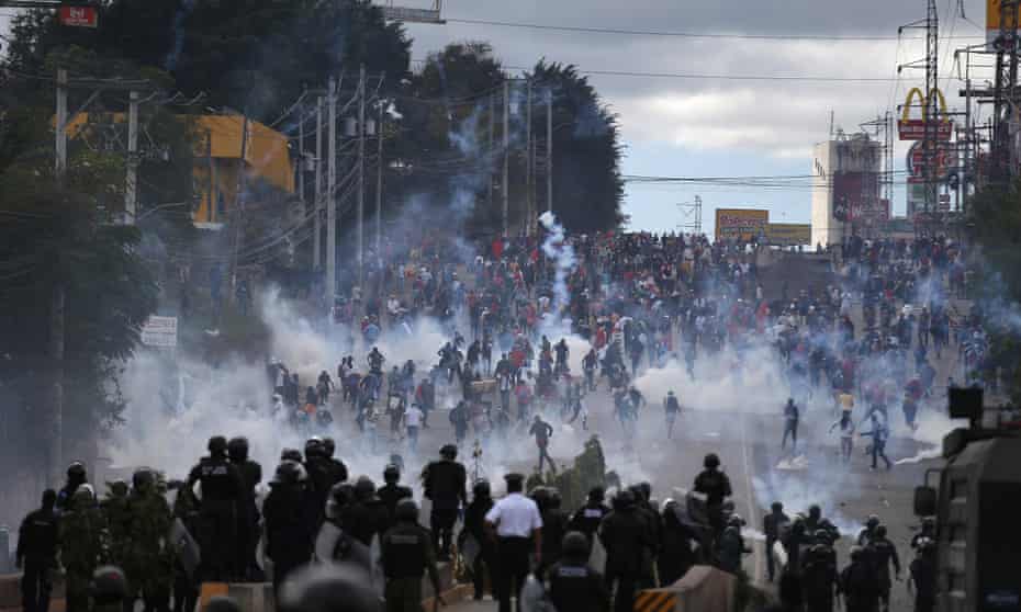 Soldiers and police launch teargas at demonstrators in Tegucigalpa, Honduras, in January.