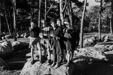 young boys holding guns