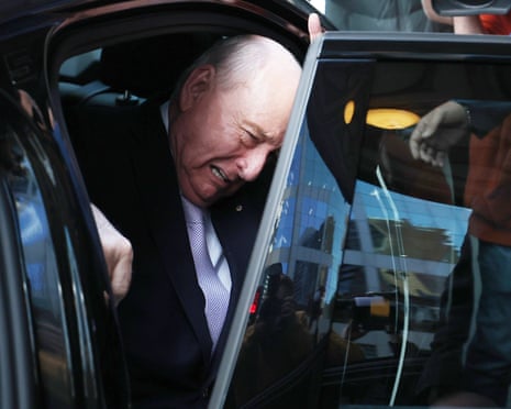 Alan Jones gets out of a car