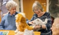 Residents of Oak Manor care home in Shefford, Bedfordshire, interact with a robot cat.