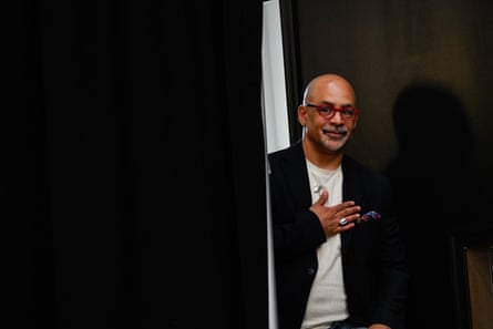 a man holds his hand on his chest