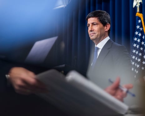 a man stands at a lectern