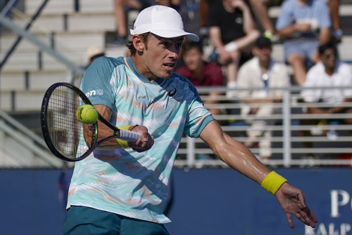 Alex de Minaur, of Australia, returns a shot to Filip Krajinovic, of Serbia, during the first round of the US Open tennis championships on Monday in New York.
