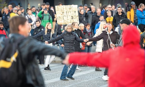 Protesters sing and dance during a rally against Covid-19 restrictions in Ljubljana, Slovenia.