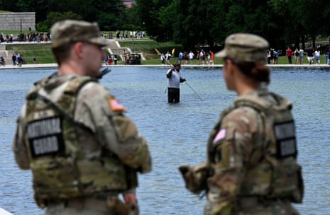 National Park Service employees used a vacuum pump to clean algae off the bottom of the newly renovated Lincoln Memorial Reflecting Pool on 19 June in Washington, DC.