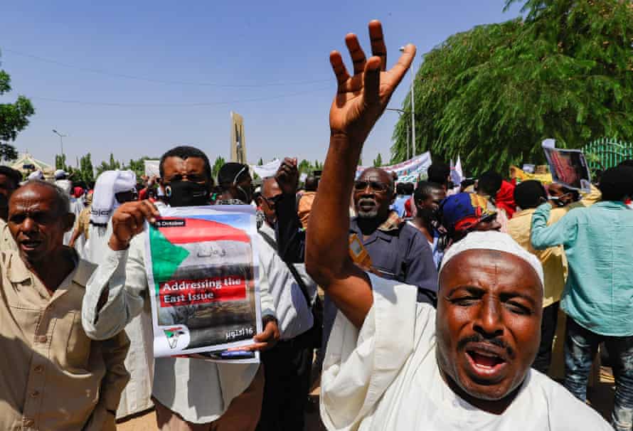 A protester holds up a sign demanding the government address hardship in the east of the country.