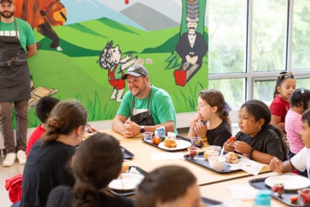 a man speaking with children
