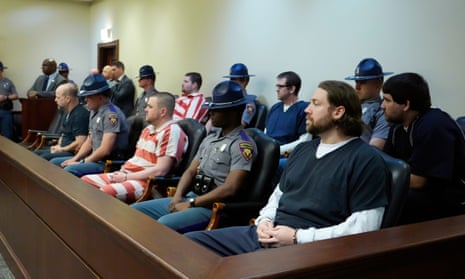 Six former Mississippi officers who pleaded guilty to a long list of state and federal charges for torturing two Black men in Braxton, Mississippi, await sentencing in state court, on Wednesday, in Brandon, Mississippi.