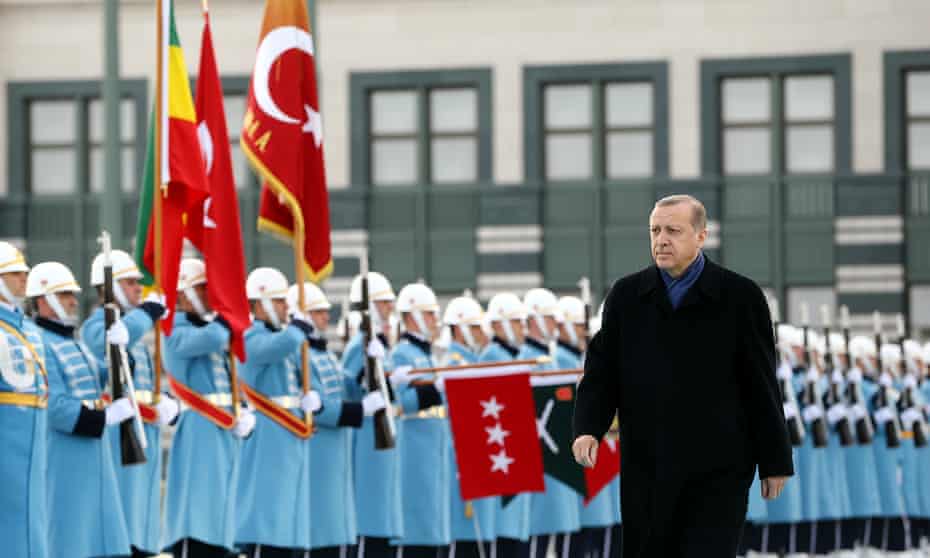 Turkish President Erdogan reviews a guard of honour
