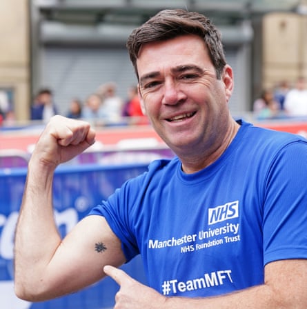 Manchester mayor Andy Burnham shows his bee tattoo