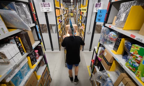 An Amazon employee prepares for Black Friday in its Hemel Hempstead centre.