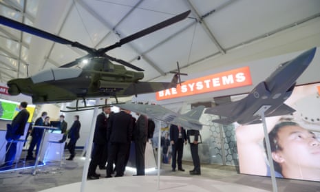 Models of aircraft and a helicopter  on display at the BAE Systems booth at an exhibition in Australia