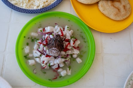 A dish of ceviche in a green bowl