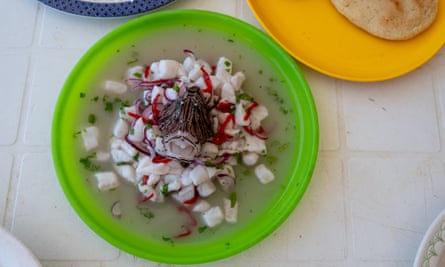 A dish of ceviche in a green bowl