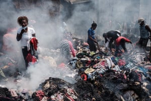Nairobi, KenyaTraders salvage clothes from the debris of a fire in the early morning at Gikomba market, East Africa’s largest second hand clothing market.