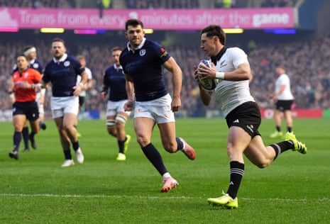New Zealand's Cam Roigard scores their first try against Scotland.