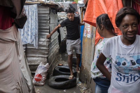 People live in flooded areas under difficult circumstances in Port-au-Prince, Haiti, as heavy rains from Hurricane Melissa affect the region.