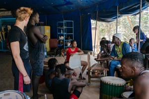 Mariétou Thiam coordinates with her troupe and the percussion band before their performance at the circus festival.