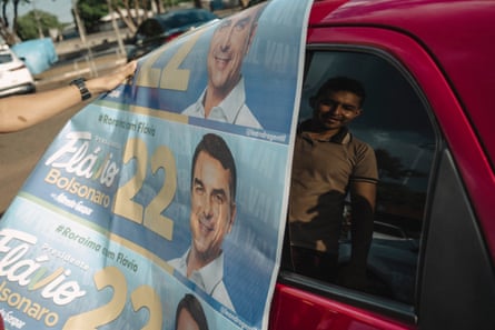 Car with Bolsonaro campaign paraphernalia featuring his face.