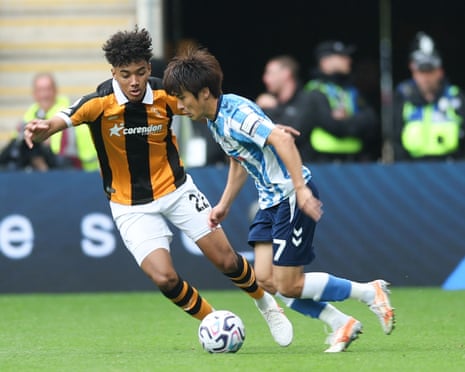 Lucas Herrington of Hull City closes down Tatsuhiro Sakamoto of Coventry City.