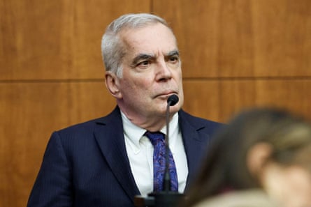 A man in front of a microphone