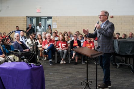 a man speaking to a crowd