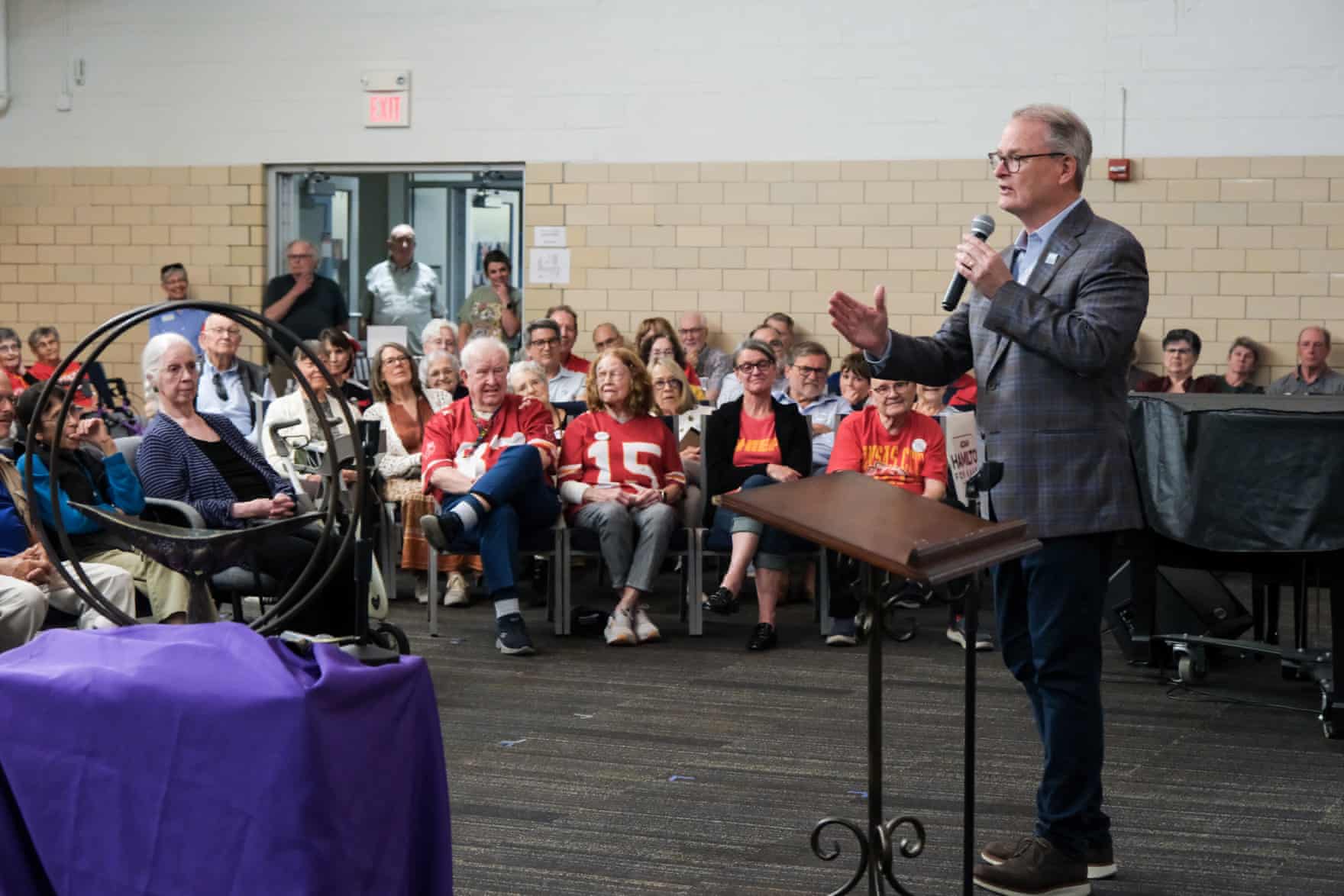 a man speaking to a crowd