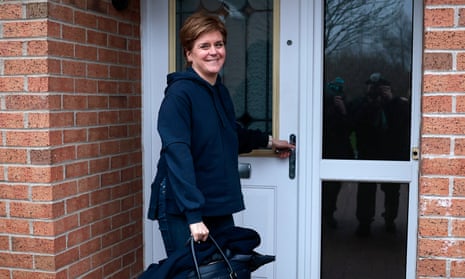 Nicola Sturgeon arrives at her home after resigning as Scotland’s first Minister.