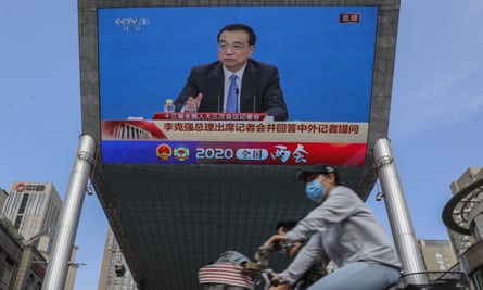 A screen showing Chinese premier Li Keqiang speaking at a press conference after the closing ceremony of the National People's Congress.