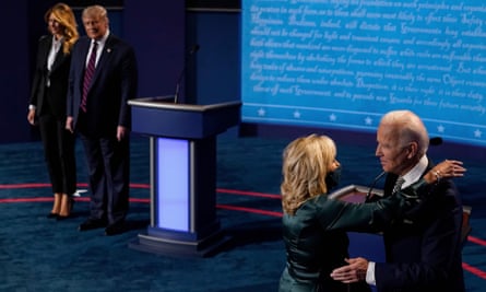 First lady Melania Trump and the president look on as Democratic presidential candidate Joe Biden hugs his wife Jill Biden after the first presidential debate in Cleveland, Ohio, on Tuesday 29 September