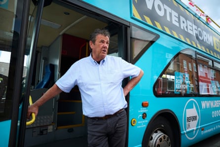 Jones stands next to the Reform bus