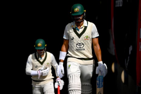Starc and Carey walk out on to the field for the start of day four.