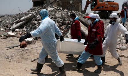 Medics carry the body of a victims allegedly killed in airstrikes carried out by warplanes of the Saudi-led coalition on 1 September.