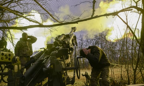 Ukrainian troops fire a howitzer at Russian positions near Bakhmut, eastern Ukraine