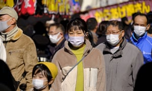 People wearing face masks as a preventive measure against the spread of Covid-19 in Tokyo.