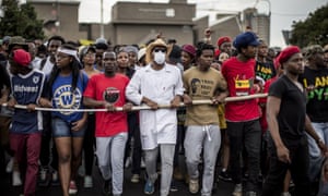 Demonstrators march through the campus of the University of the Witwatersrand in Johannesburg