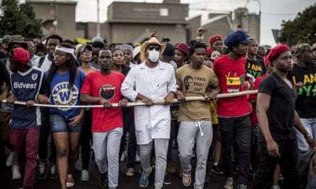 Demonstrators march through the campus of the University of the Witwatersrand in Johannesburg