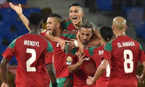 The Morocco players celebrate after the opening goal.