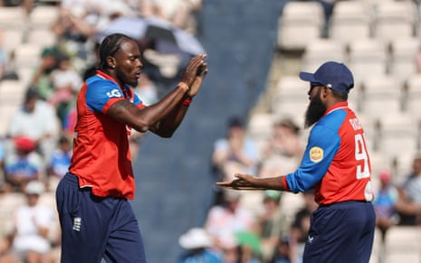 England's Jofra Archer celebrates with Adil Rashid after taking the wicket of India's Abhishek Sharma.