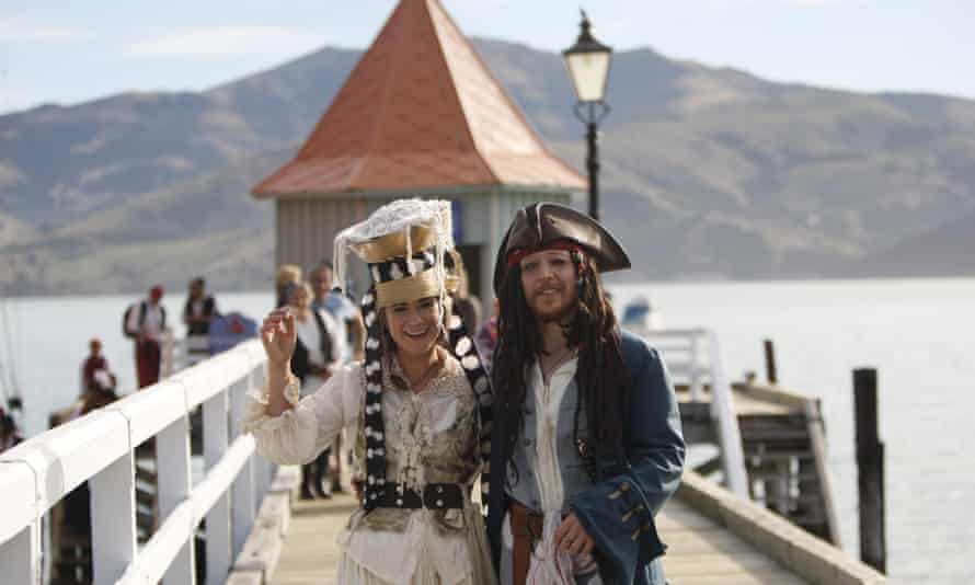 Bride Marianna Fenn and bridegroom Toby Ricketts stand on a jetty in Akaroa harbor, New Zealand, Saturday April 16, 2016.