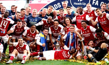 Arsenal players and staff celebrate with the trophy after winning the Heads Up FA Cup final.