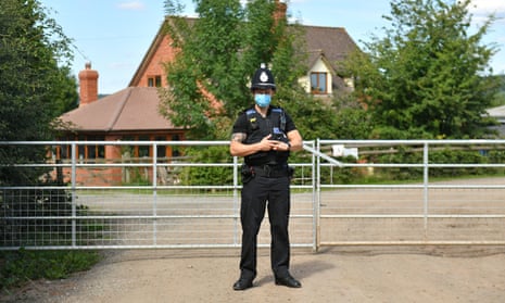 Police officer outside the farm