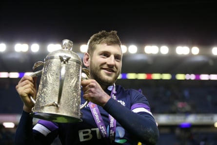 Finn Russell holds the Calcutta Cup after his inspirational performance.