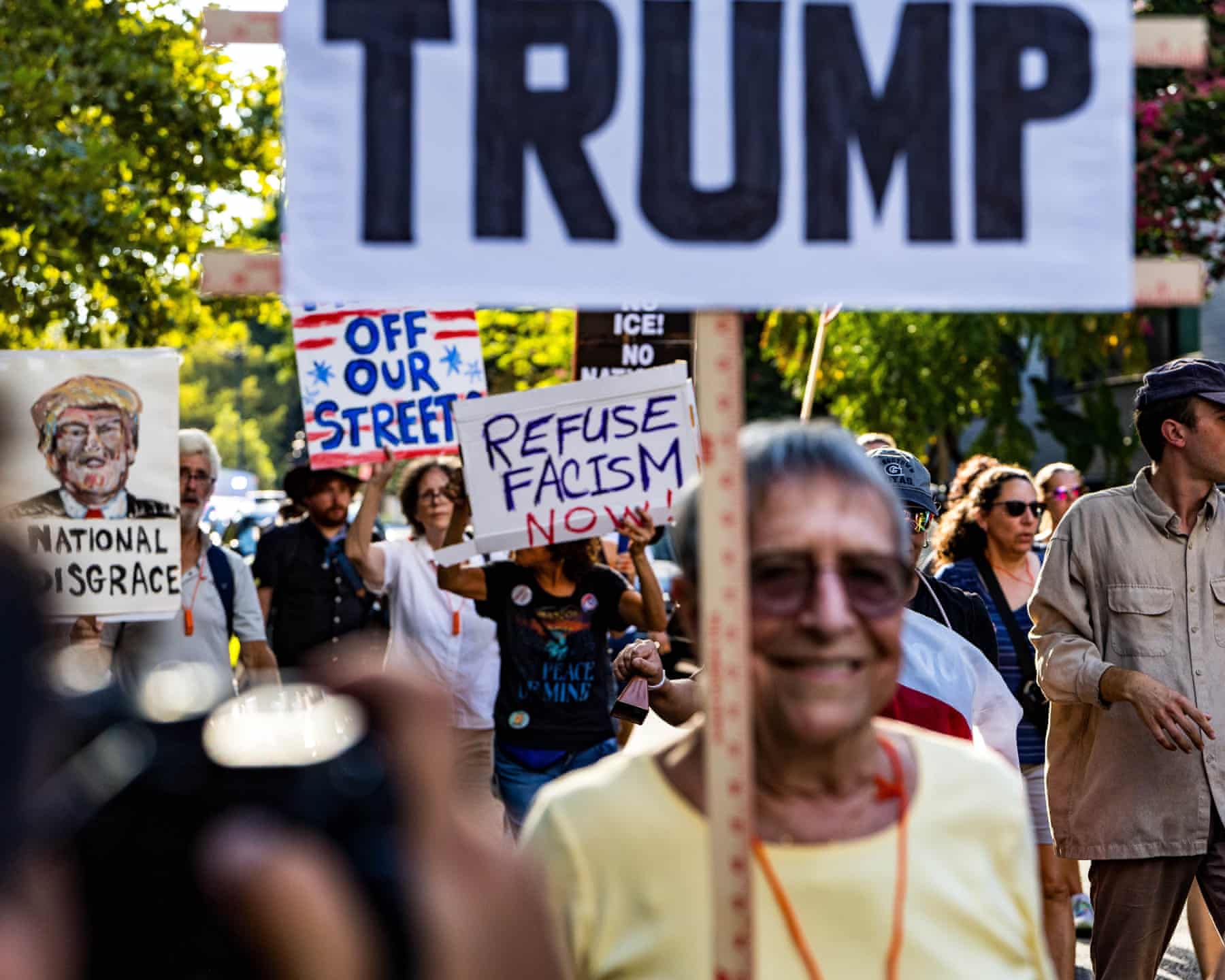 Protesters in Washington DC demonstrate against federal takeover of police force